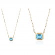Blue Topaz Emerald Cut Bezel Pendant In 18K Yellow Gold.