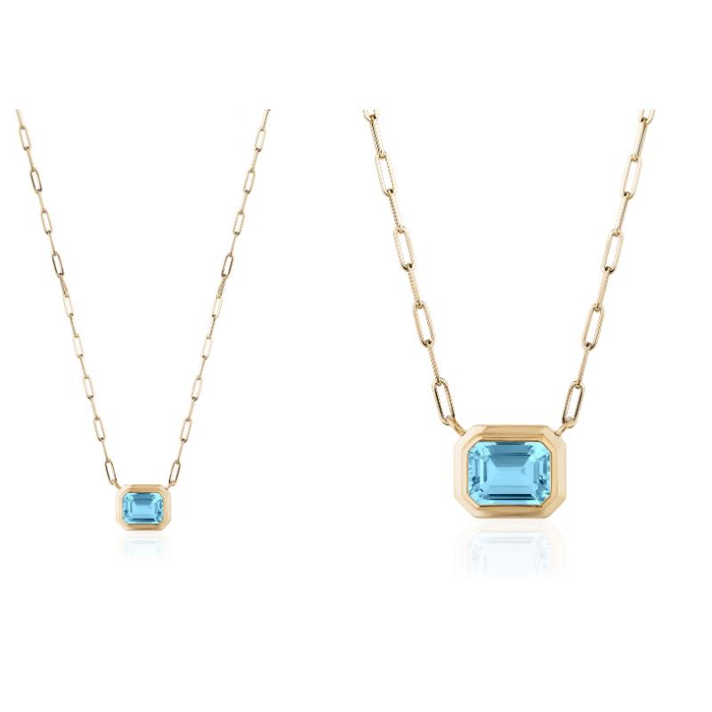 Blue Topaz Emerald Cut Bezel Pendant In 18K Yellow Gold.